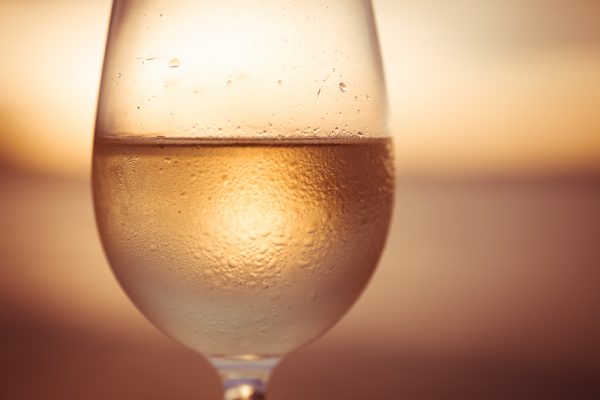 Wineglass of white wine at sunset Opawa Sauvignon Blanc 2020, Marlborough